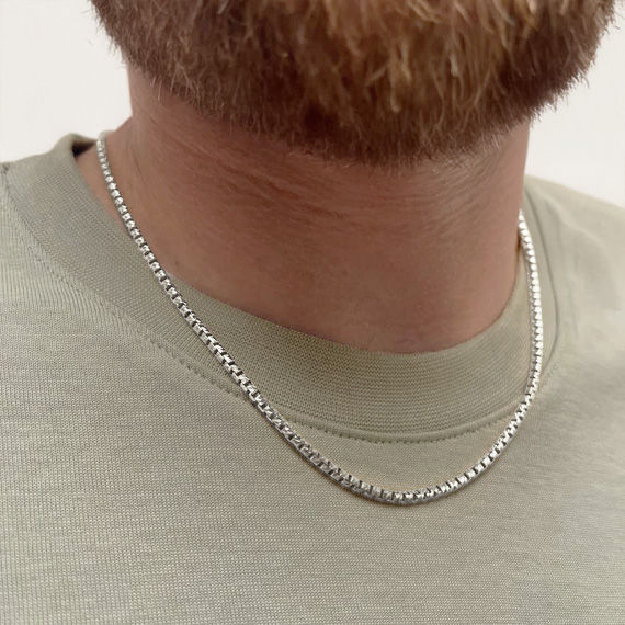 It is lighter in weight than I expected, tho it is silver. Agent was very responsive and it comes nicely gift boxed.